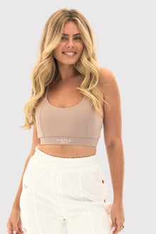 Flexara™ Light Support Strappy Sports Bra in Nude – front view